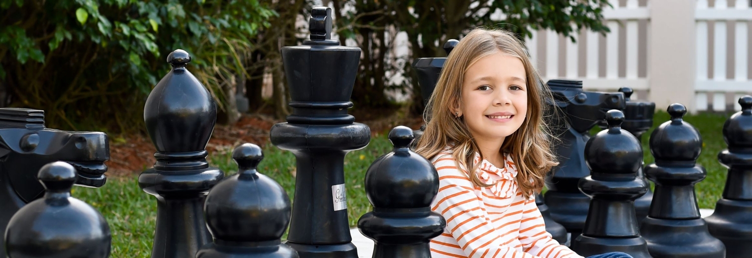 Avery with Chess Pieces